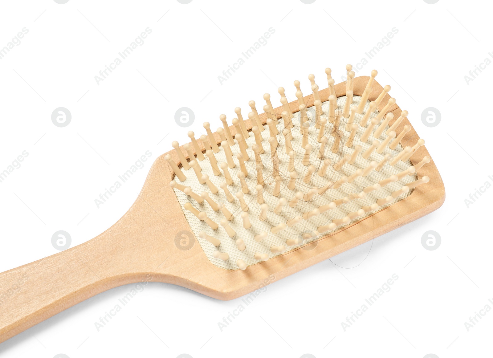 Photo of Wooden brush with lost hair isolated on white