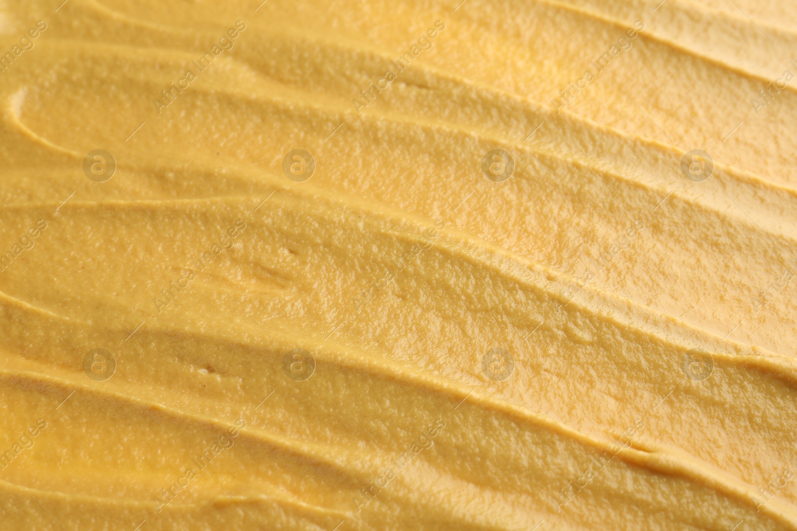 Photo of Fresh tasty mustard sauce as background, closeup