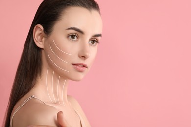 Attractive woman with perfect skin after cosmetic treatment on pink background, space for text. Lifting arrows on her face