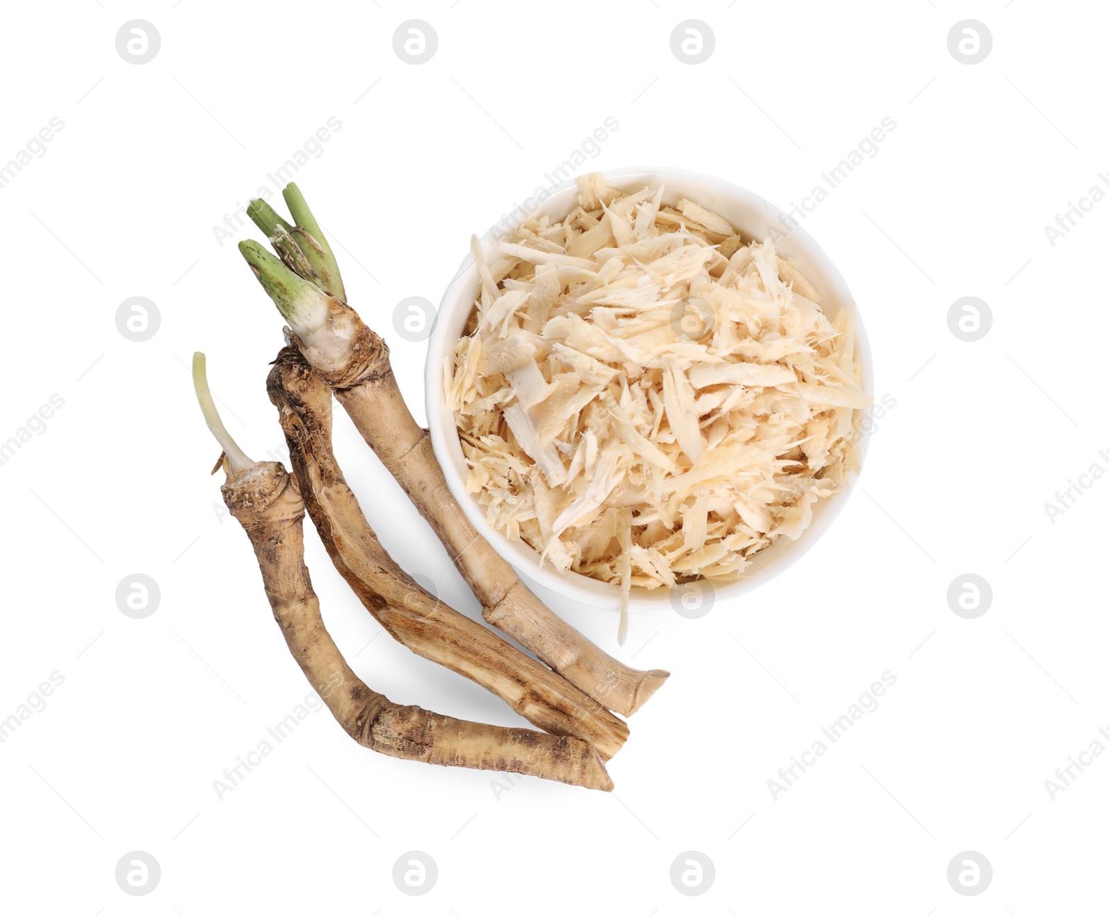 Photo of Grated and cut horseradish roots isolated on white, top view