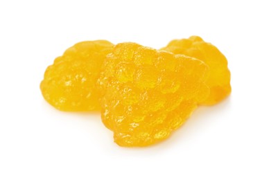 Delicious gummy golden raspberry candies on white background