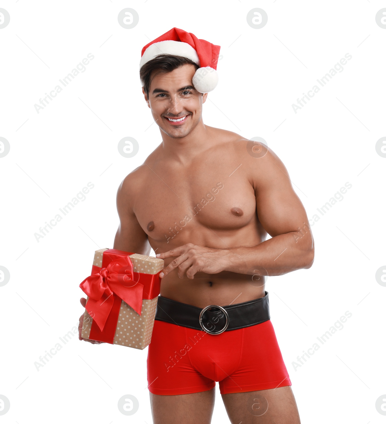 Photo of Sexy shirtless Santa Claus with gift on white background