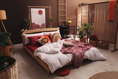 Modern interior of stylish room with large comfortable bed