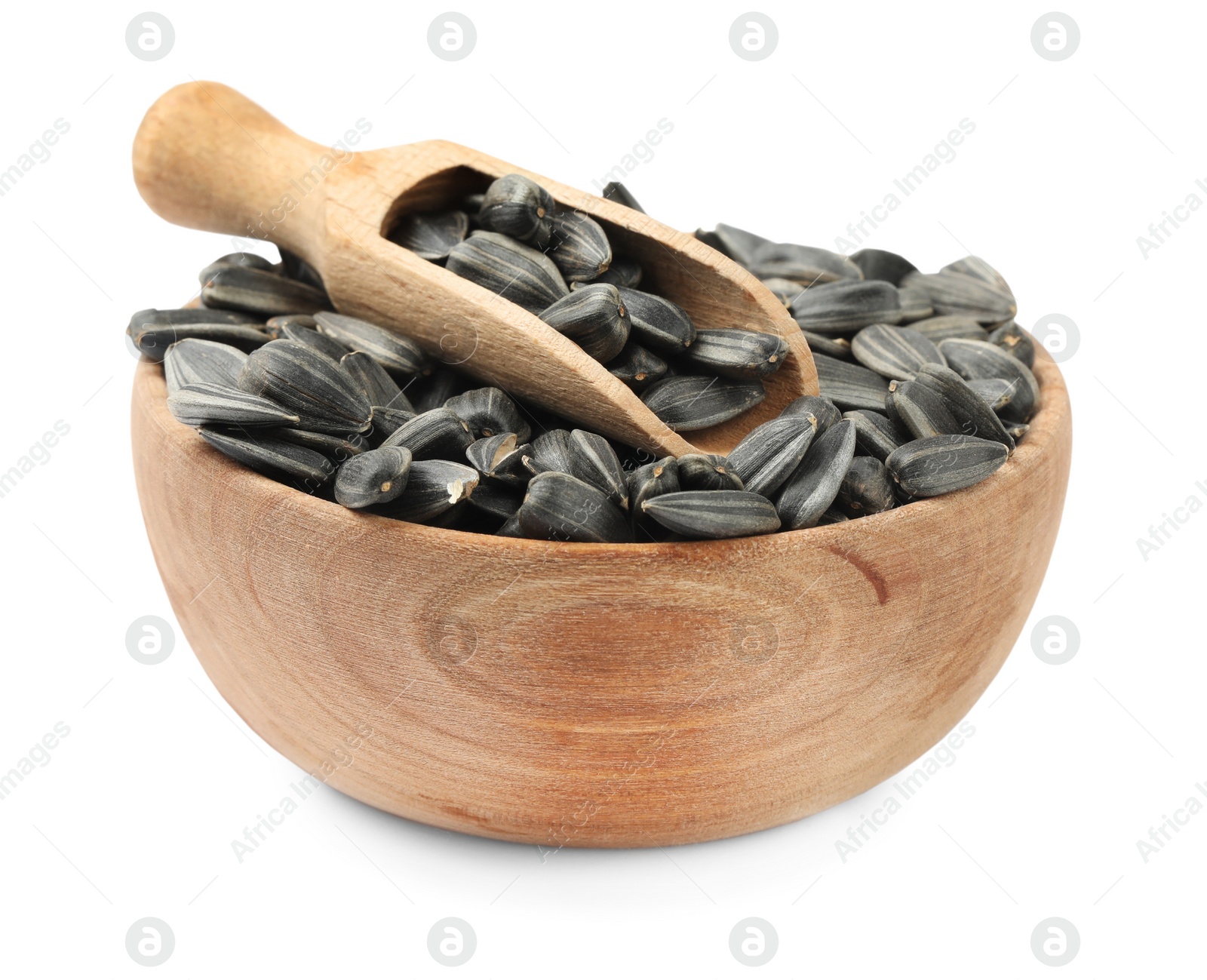Photo of Raw organic sunflower seeds in wooden bowl isolated on white