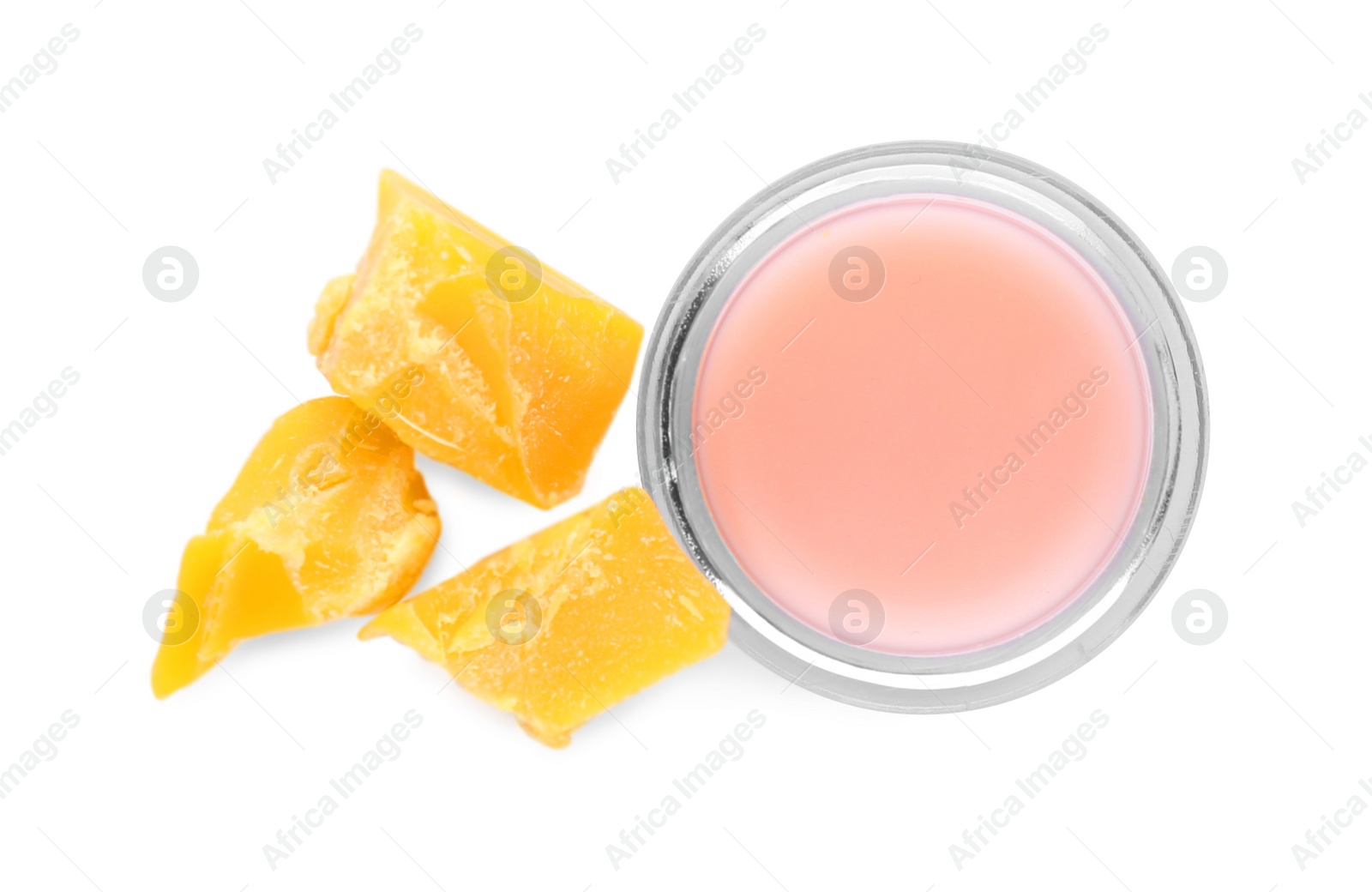 Photo of Lip balm and natural beeswax on white background, top view