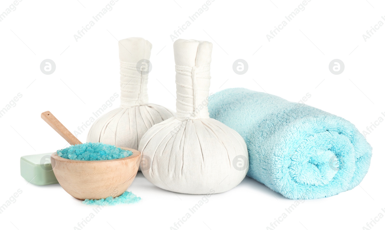 Photo of Herbal massage bags and other spa products on white background