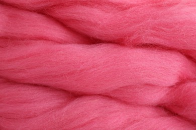 Photo of Pink felting wool as background, closeup view