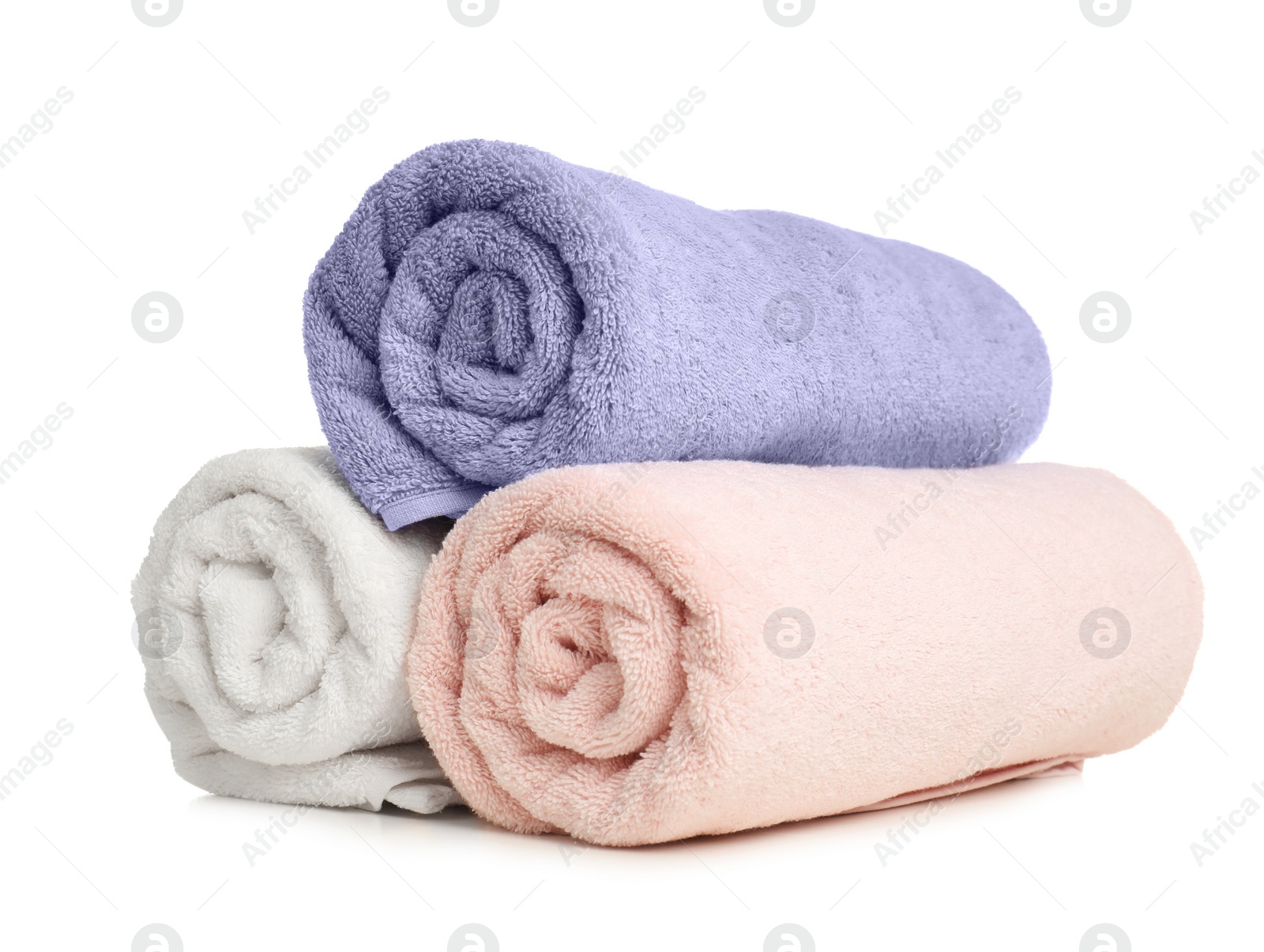 Photo of Rolled soft terry towels on white background