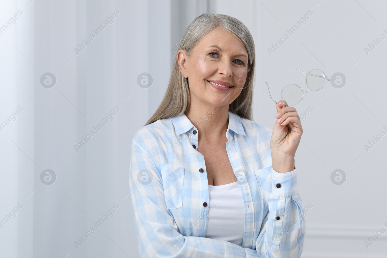 Photo of Portrait of beautiful senior woman with gray hair indoors