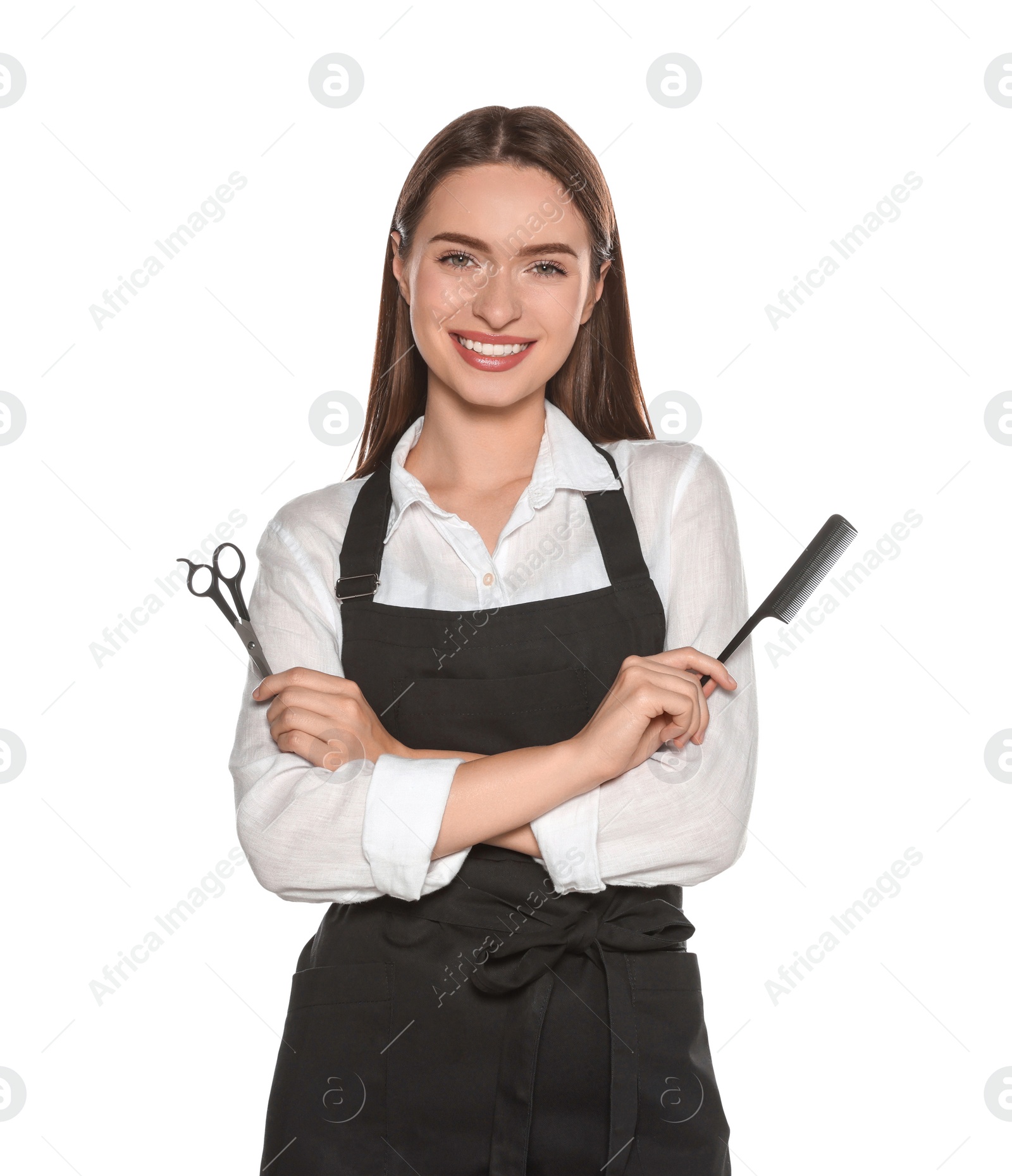 Photo of Portrait of happy hairdresser with scissors and comb on white background