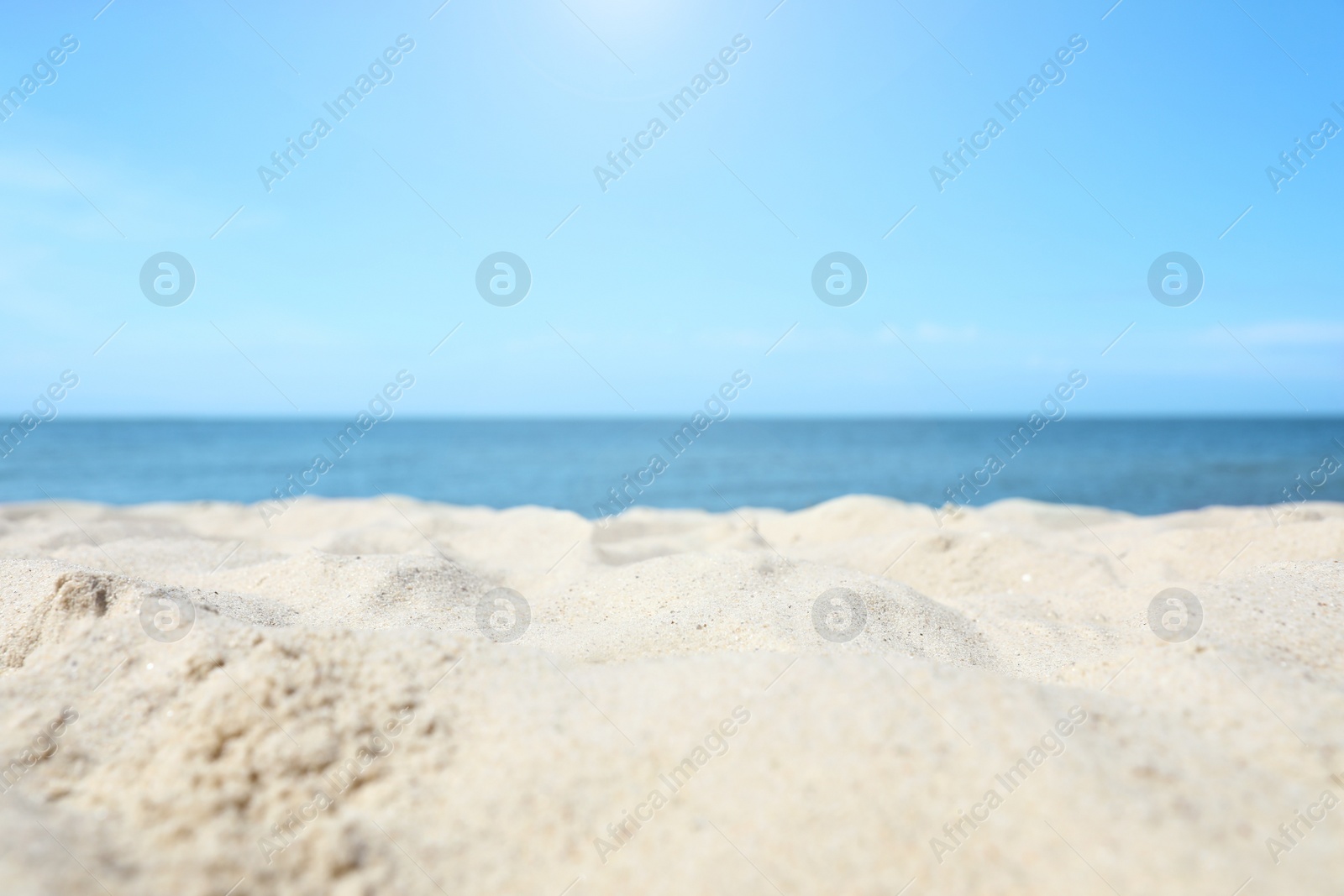 Photo of Sandy beach near sea on sunny day