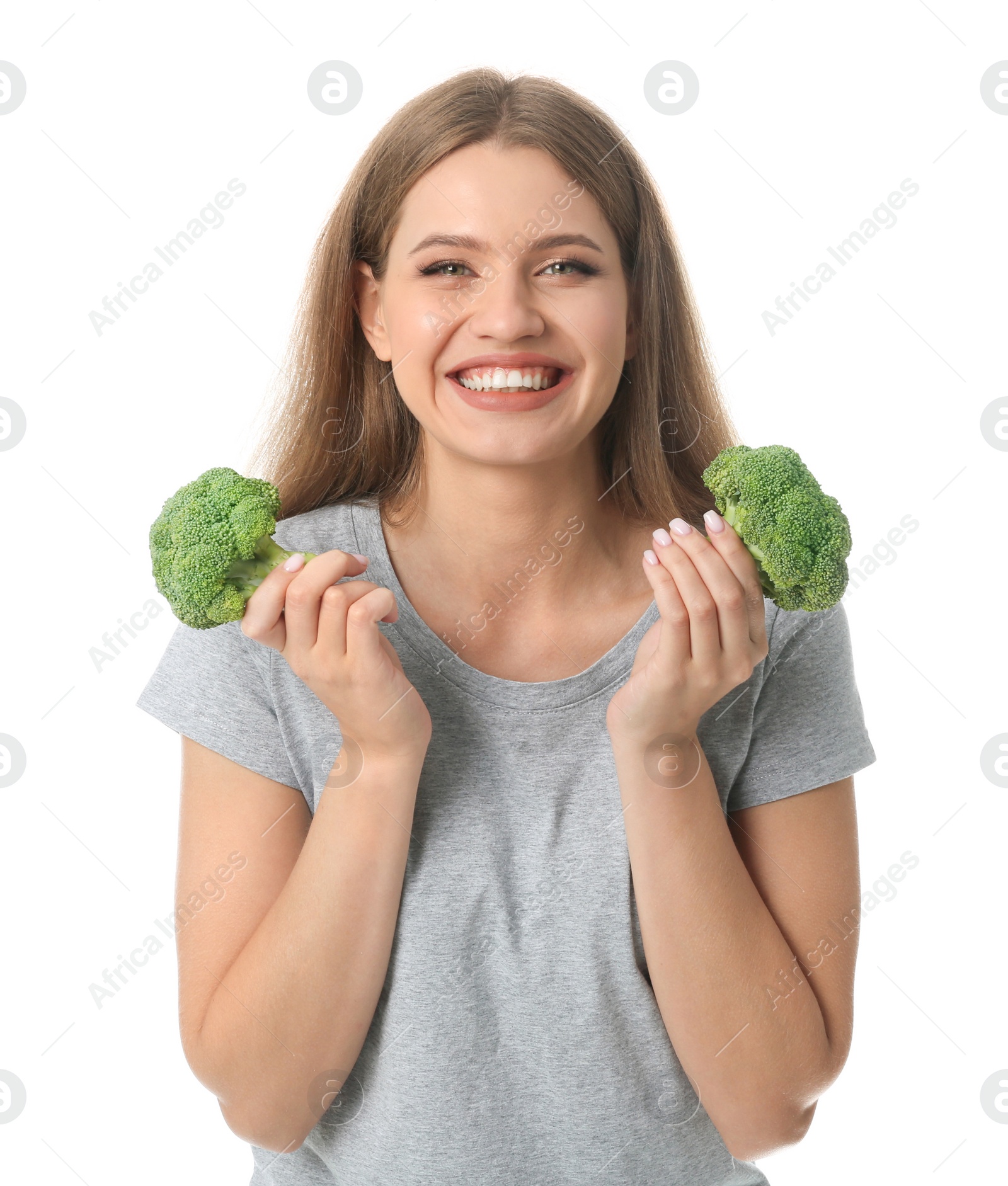 Photo of Portrait of happy woman with broccoli on white background