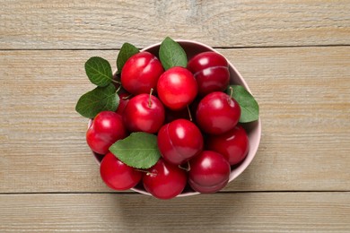 Fresh ripe cherry plums on wooden table, top view