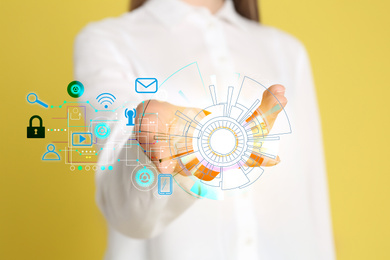 Image of Modern technology concept. Woman on yellow background, closeup