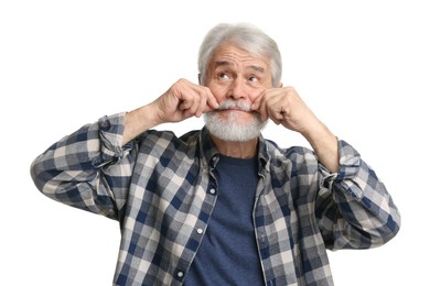 Senior man touching mustache on white background