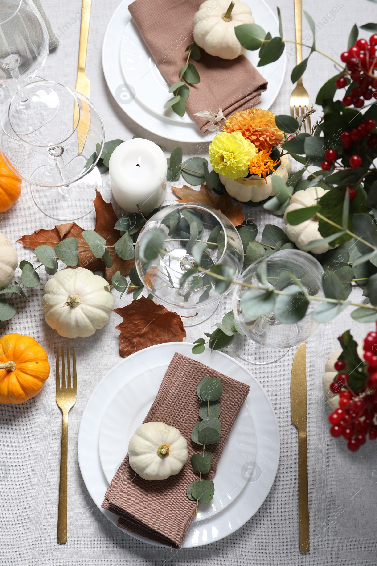 Photo of Beautiful autumn table setting. Plates, cutlery, glasses and floral decor, flat lay