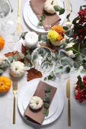 Photo of Beautiful autumn table setting. Plates, cutlery, glasses and floral decor, flat lay