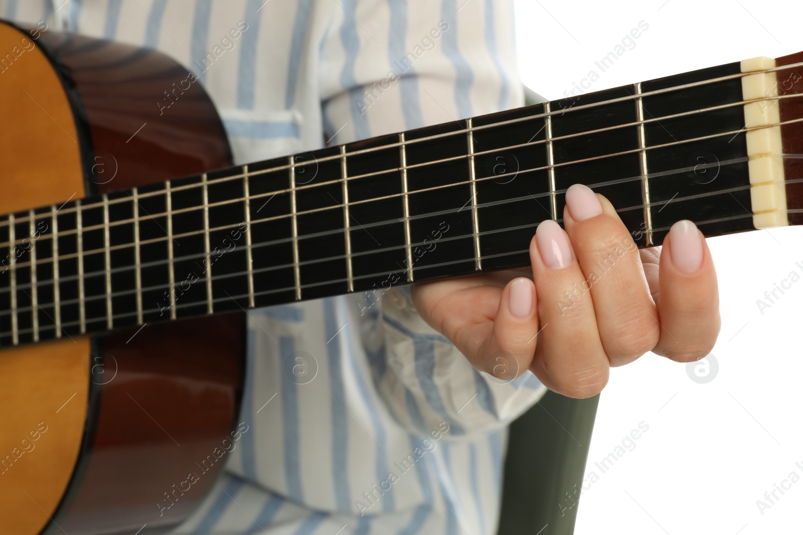 Photo of Music teacher playing acoustic guitar, closeup view