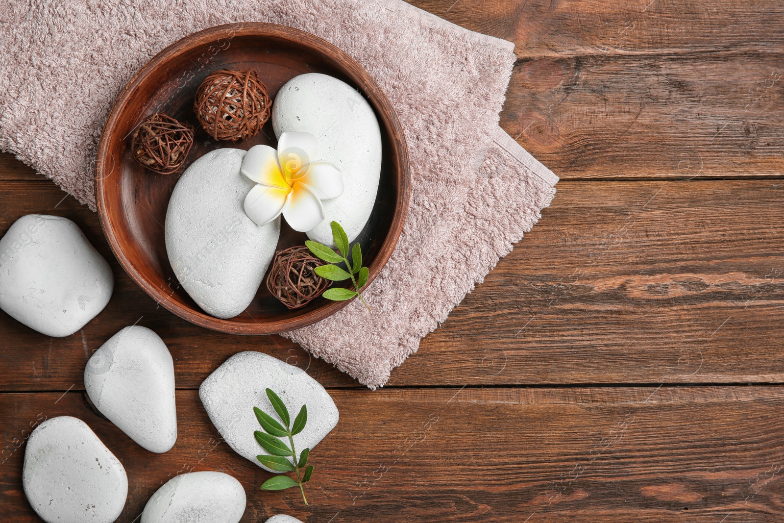 Photo of Flat lay composition with spa stones and space for text on wooden background