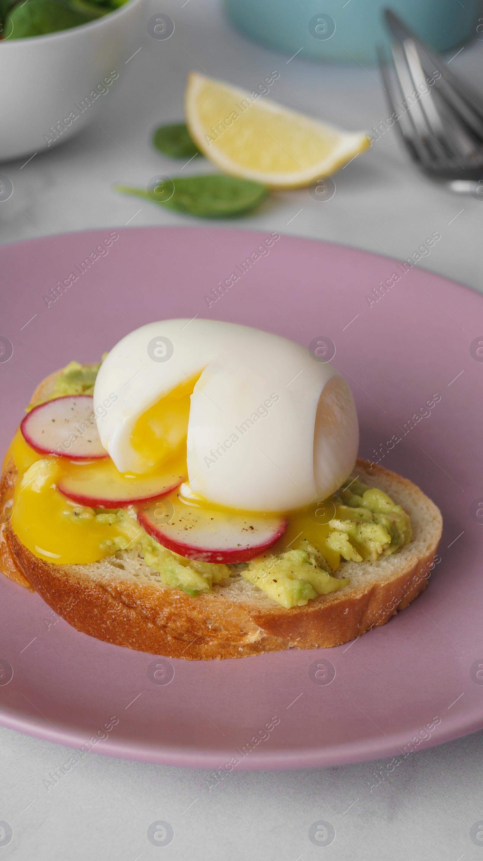 Photo of Tasty sandwich with boiled egg and radish on white table, closeup