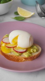 Photo of Tasty sandwich with boiled egg and radish on white table, closeup