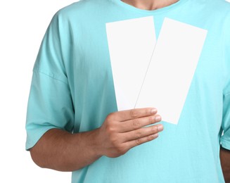 Man holding flyers on white background, closeup. Mockup for design