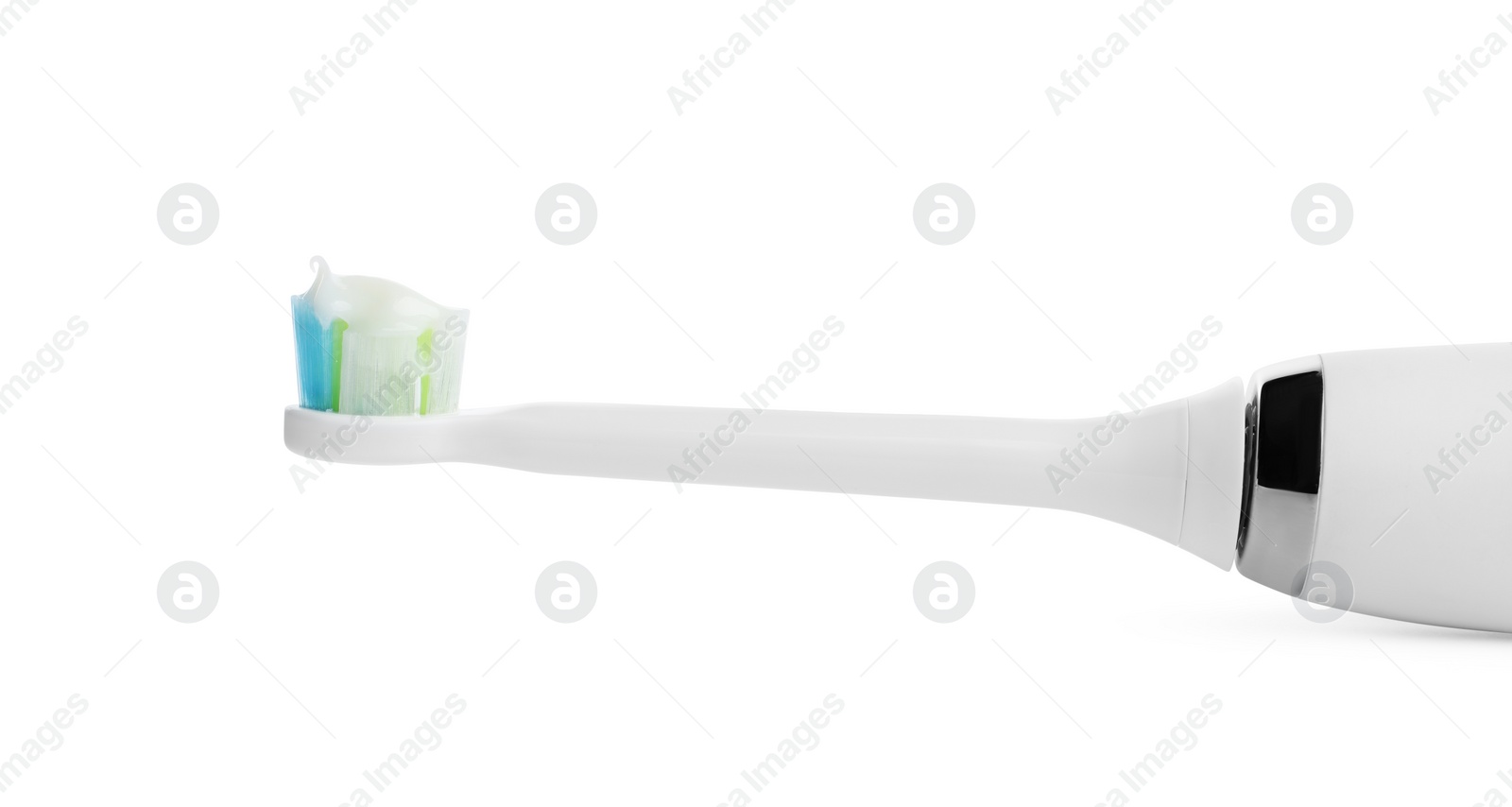 Photo of Electric toothbrush with paste on white background, closeup