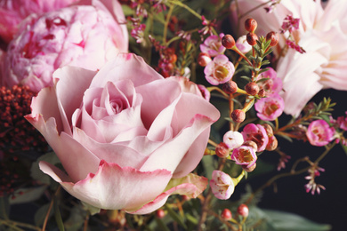 Beautiful fresh bouquet on dark background, closeup. Floral decor