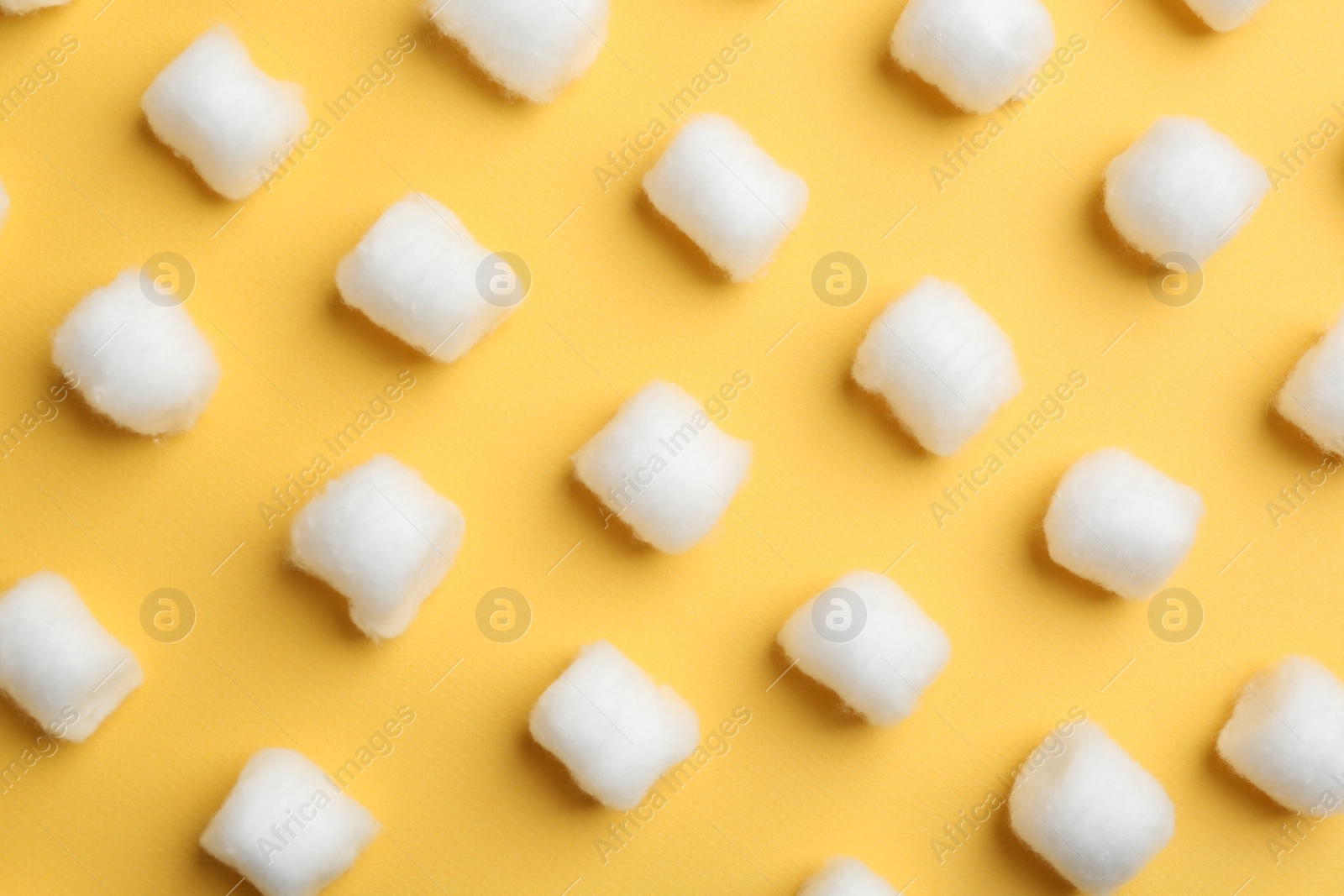 Photo of Many fluffy cotton balls on color background, flat lay