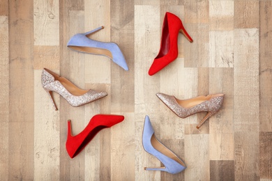 Photo of Different female shoes on floor, top view