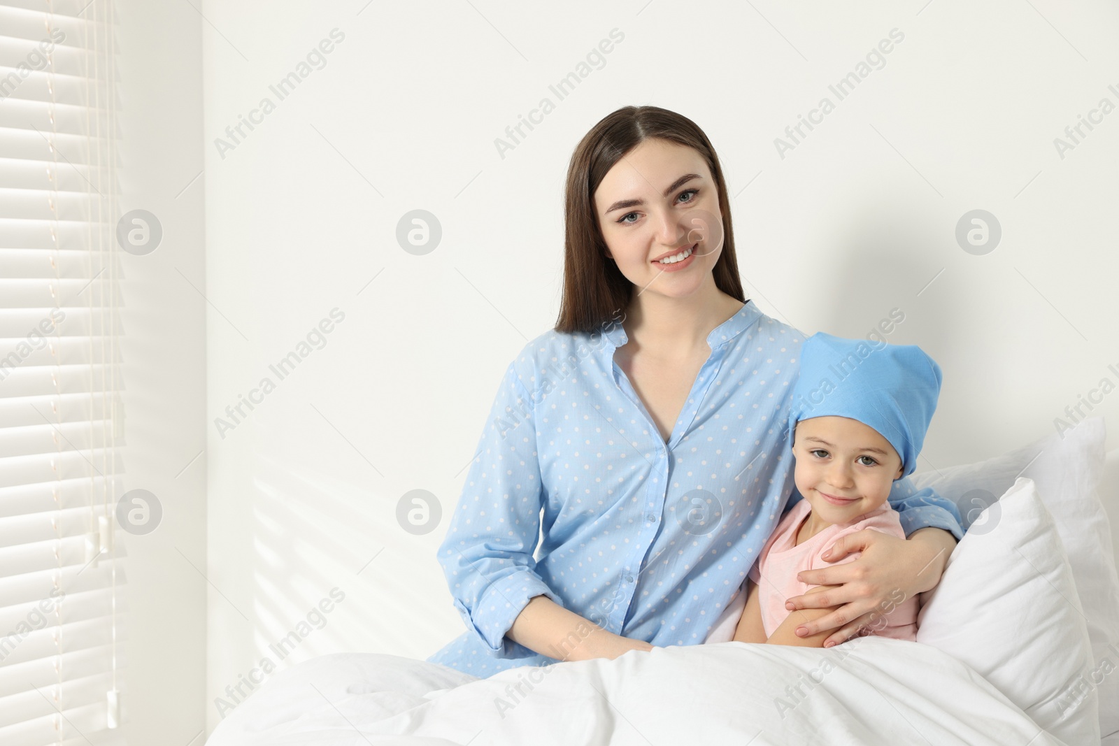 Photo of Childhood cancer. Mother and daughter in hospital