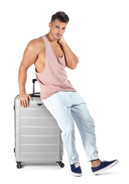 Photo of Young man with suitcase on white background