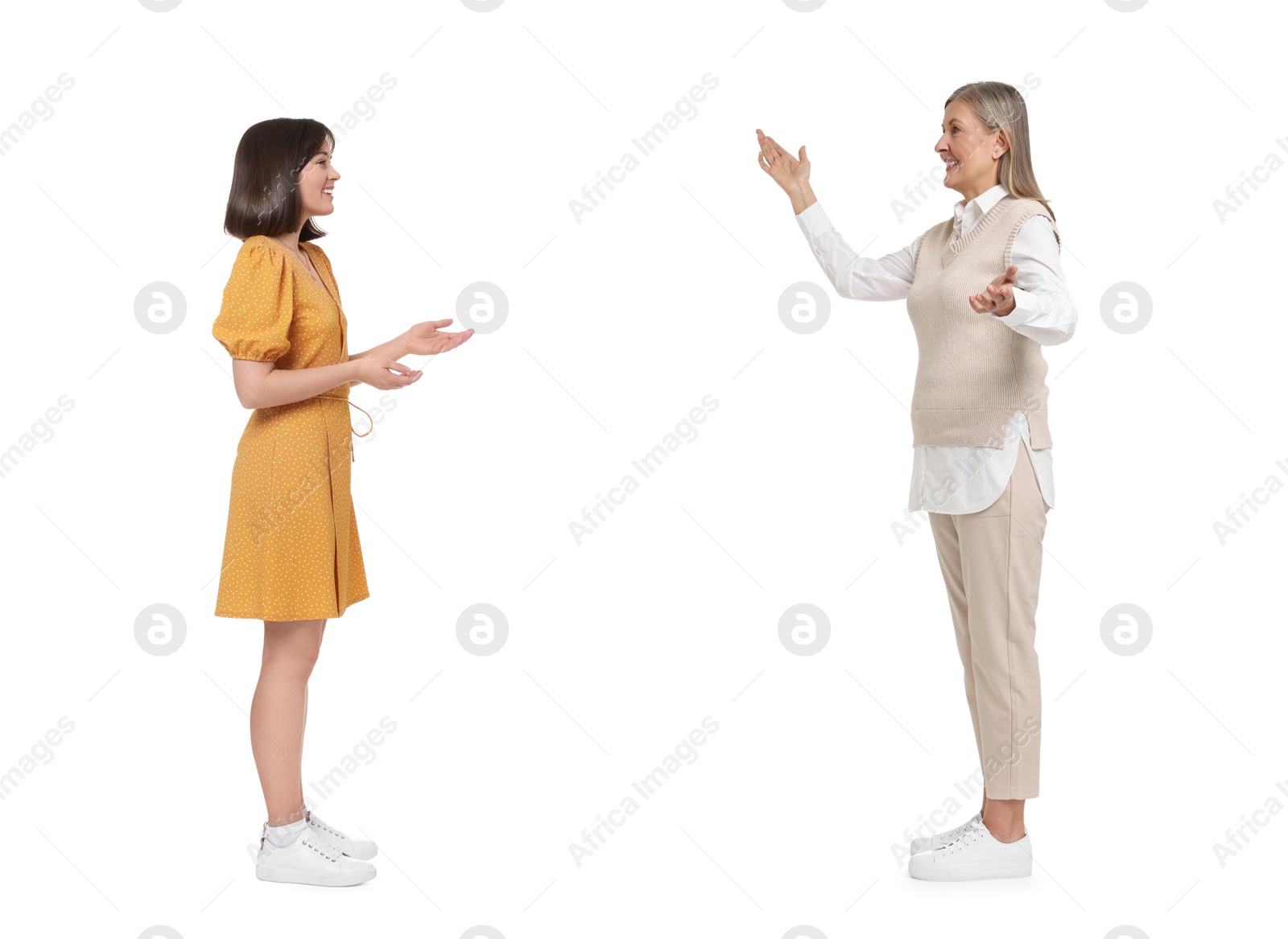 Image of Two women talking on white background. Dialogue