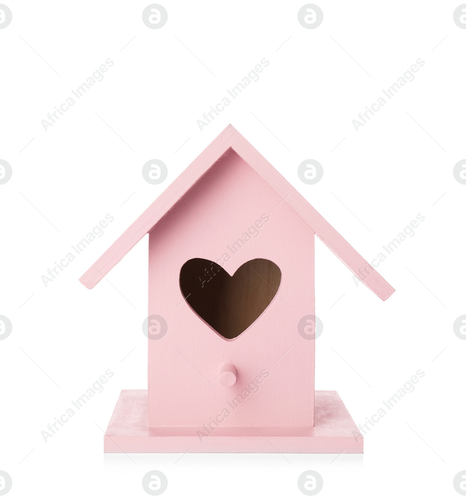 Photo of Beautiful pink bird house with heart shaped hole isolated on white