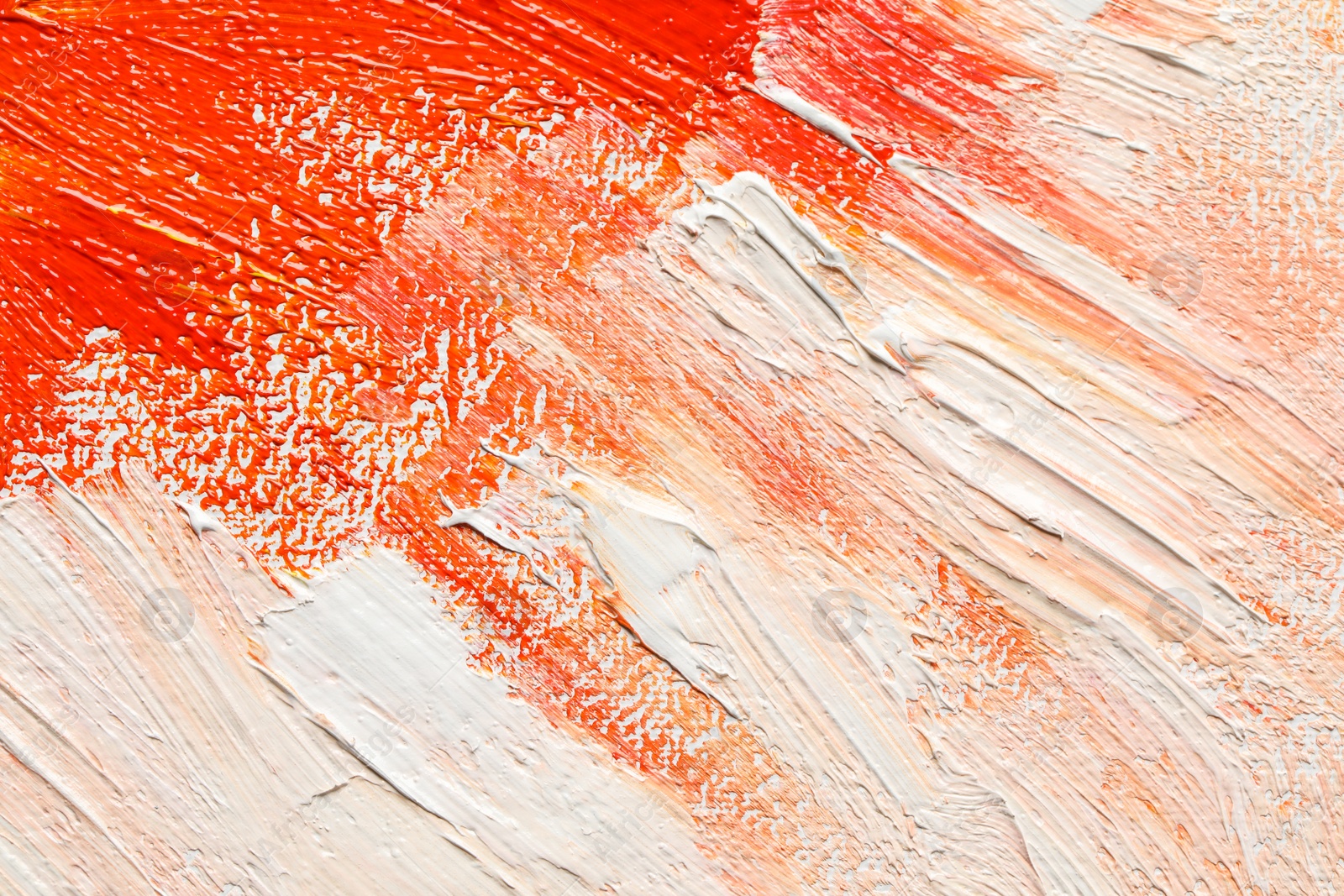 Photo of Beautiful strokes of colorful oil paints as background, closeup