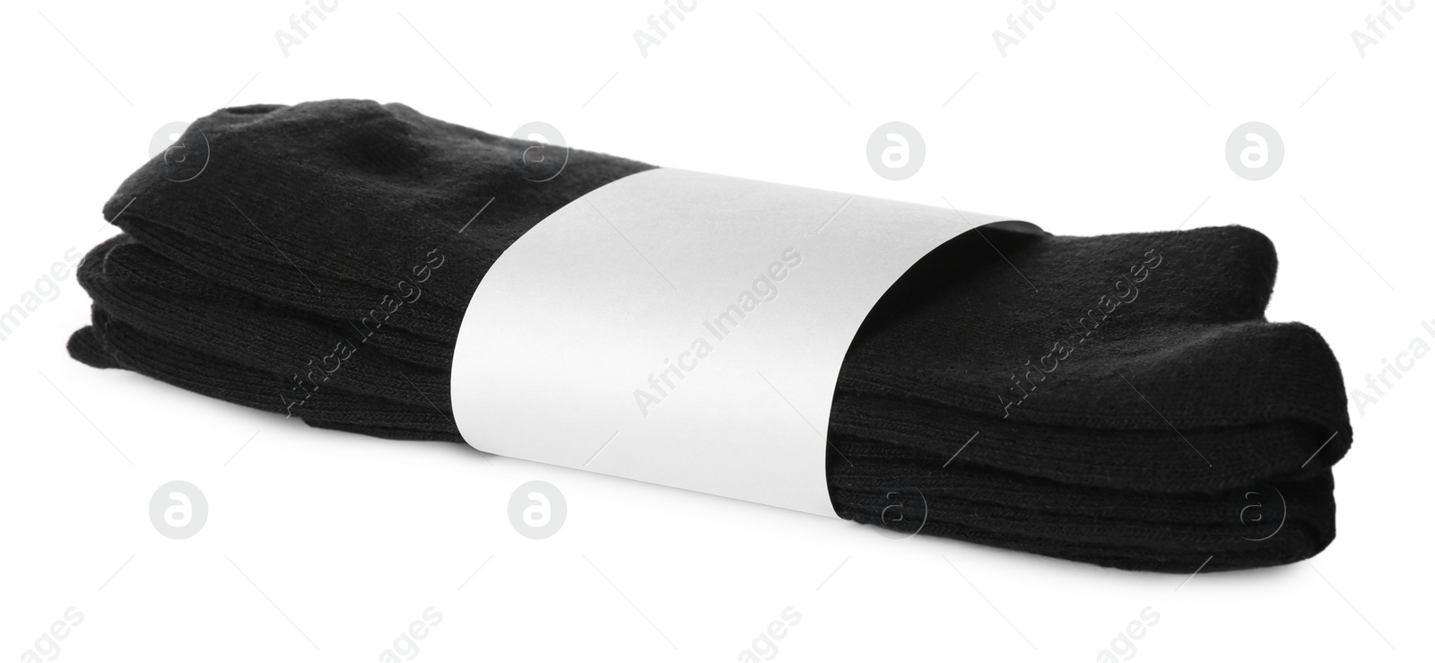 Photo of New pairs of black cotton socks on white background