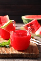 Photo of Summer watermelon drink served on wooden board