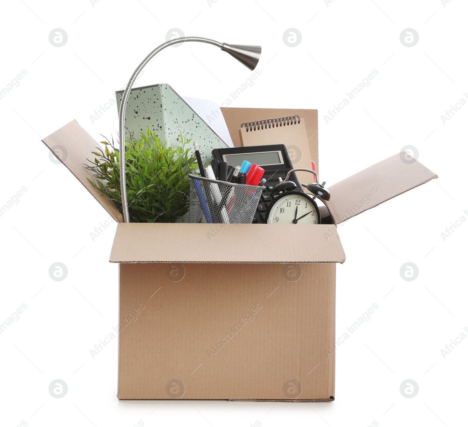 Photo of Cardboard box full of office stuff on white background