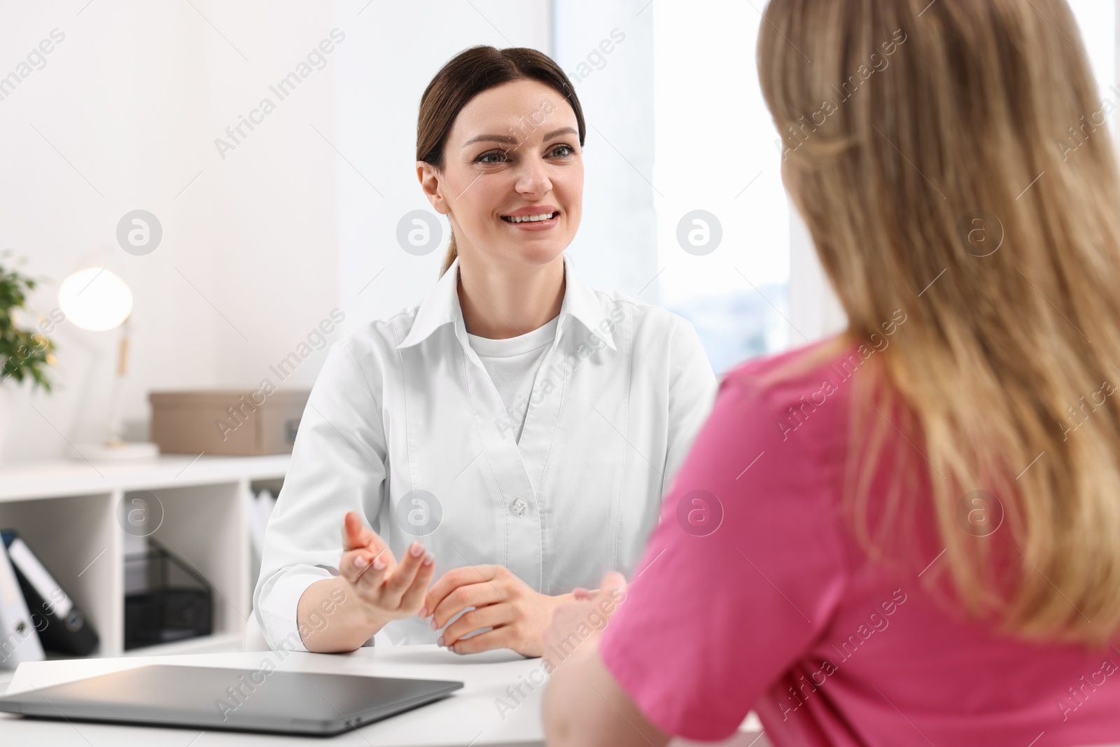 Photo of Mammologist consulting woman during appointment in hospital