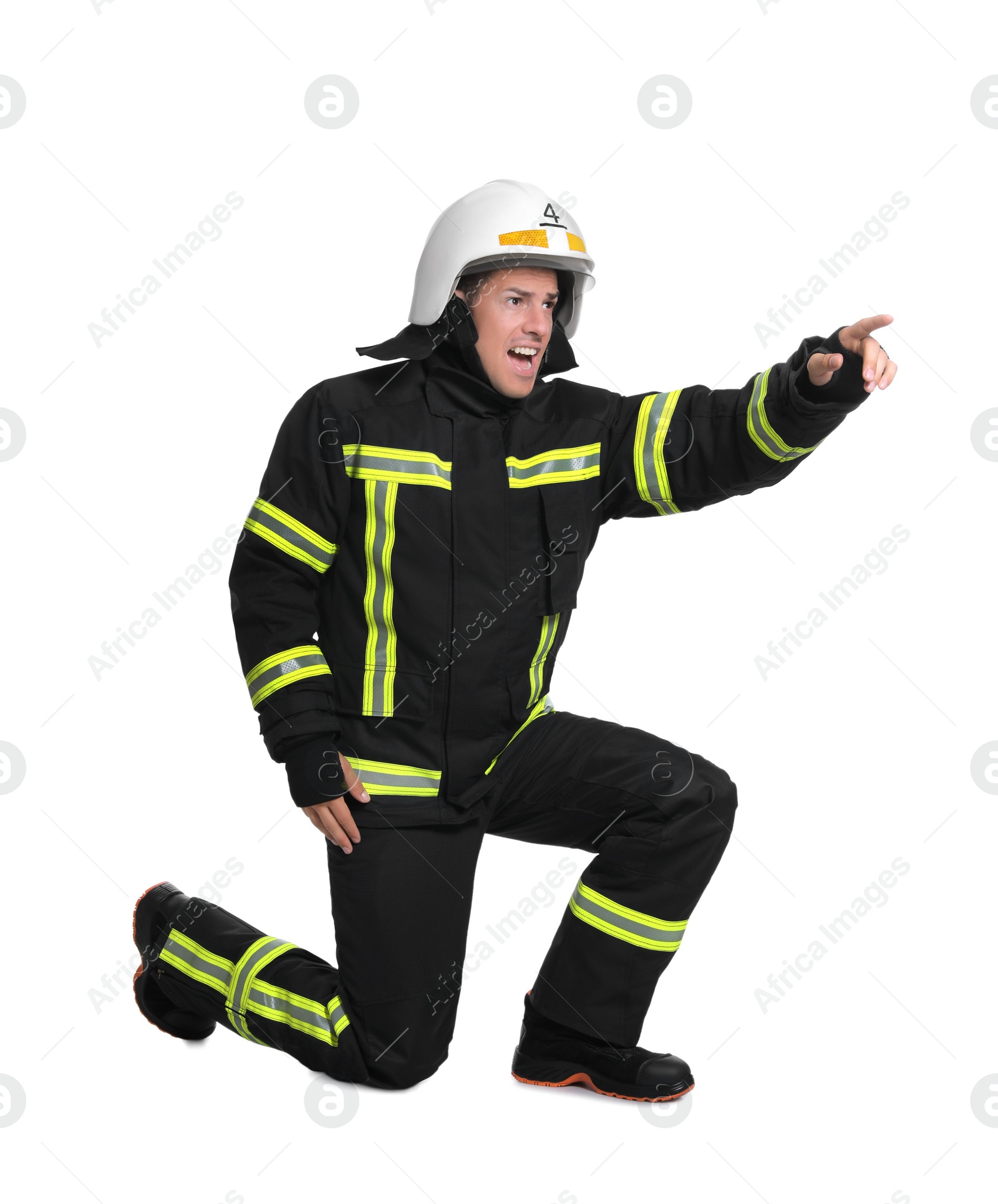 Photo of Full length portrait of firefighter in uniform and helmet on white background