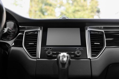Photo of Modern navigation system with screen in car