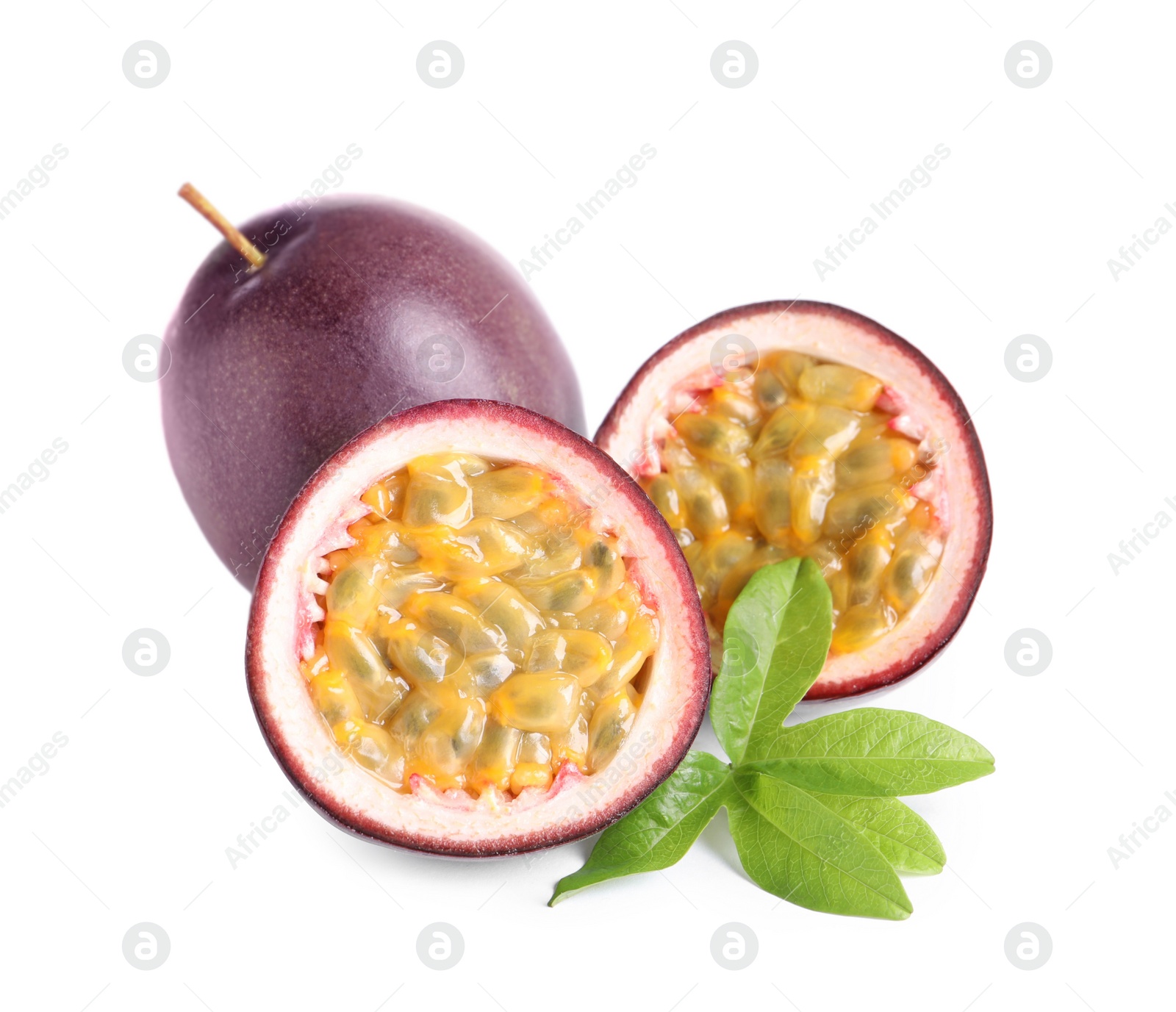 Photo of Cut and whole passion fruits with leaf isolated on white