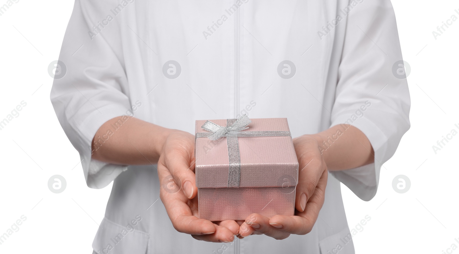 Photo of Doctor holding gift box on white background, closeup. Medical present