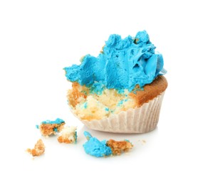 Photo of Failed cupcake with cream on white background. Troubles happen