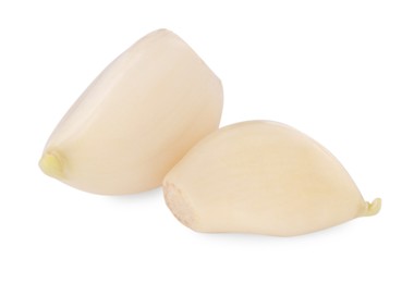 Photo of Peeled cloves of fresh garlic isolated on white