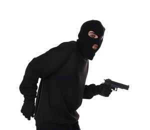 Thief in balaclava with gun on white background