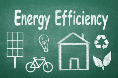 Image of Energy efficiency concept. House and different icons drawn on chalkboard