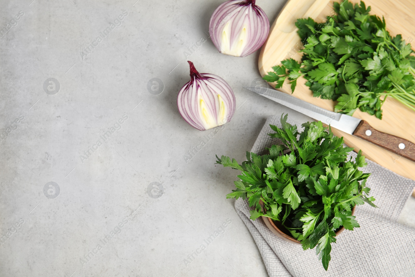 Photo of Flat lay composition with fresh green parsley and space for text on grey background