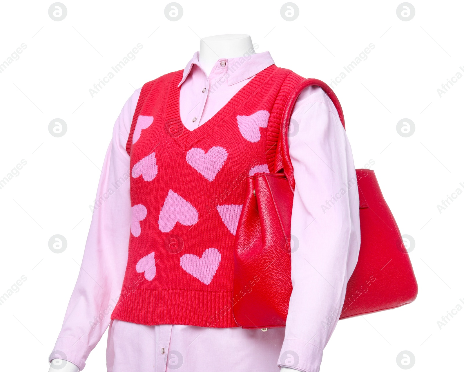 Photo of Female mannequin dressed in sweater vest and shirt with bag isolated on white. Stylish outfit