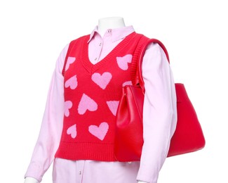 Female mannequin dressed in sweater vest and shirt with bag isolated on white. Stylish outfit